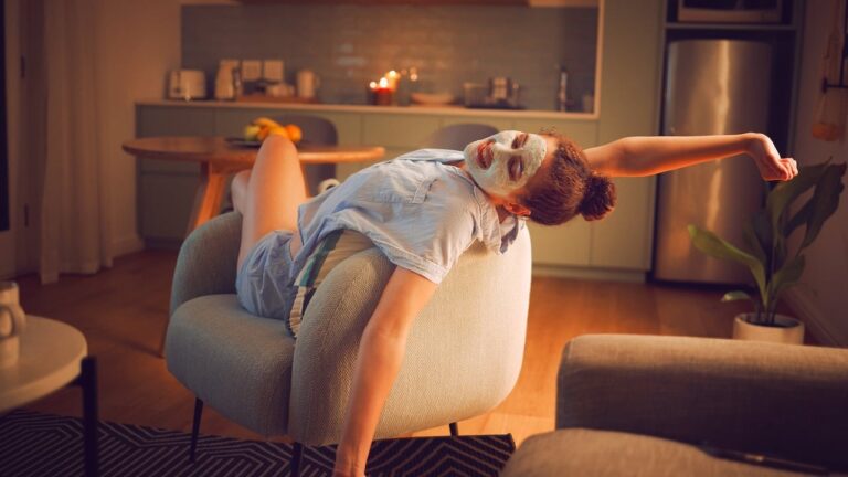 Woman enjoys home pampering with face mask