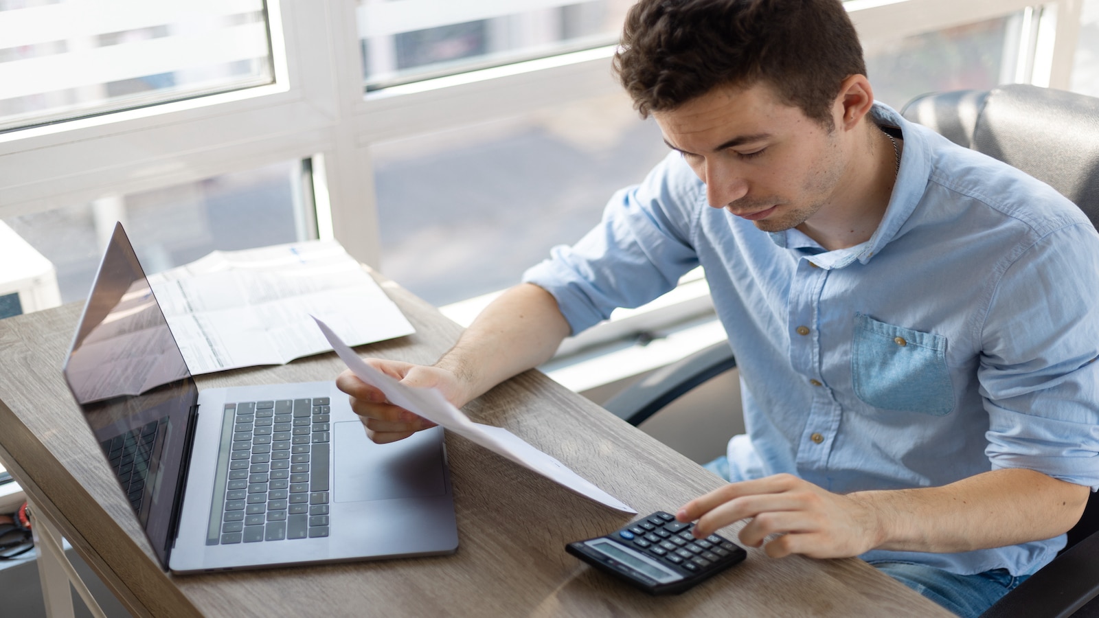 man working on finances.