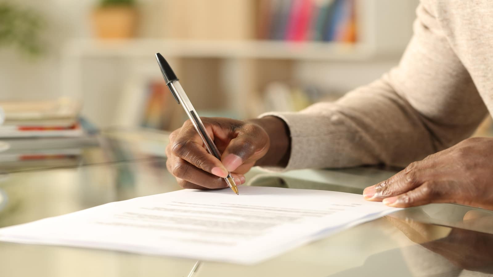 man filling out application close-up.