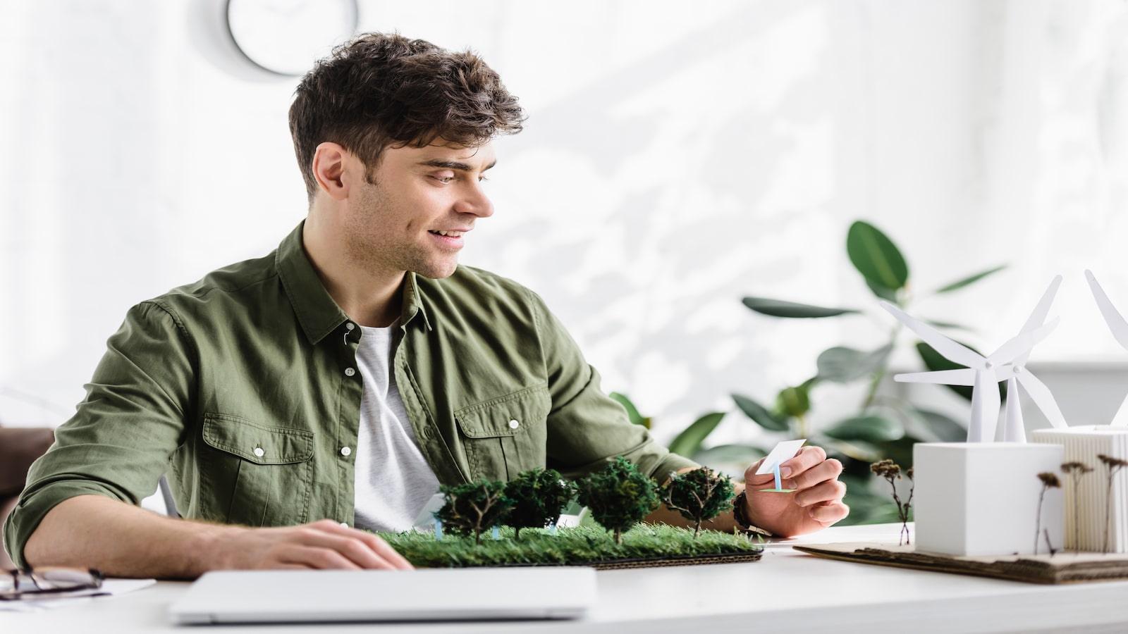 Man smiling at desk with high energy level