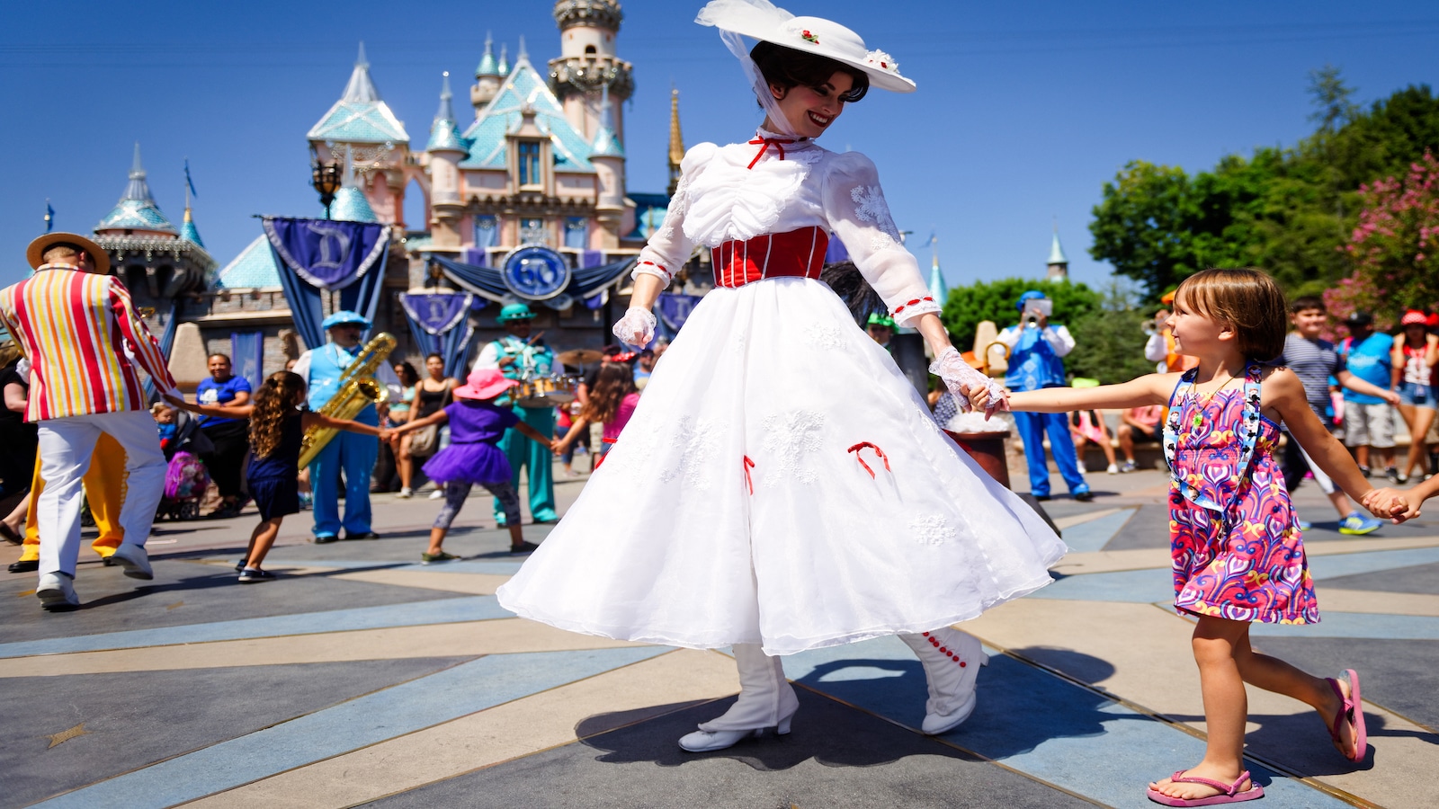 mary poppins and young girl at disneyland