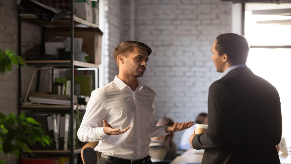 men talking at work.