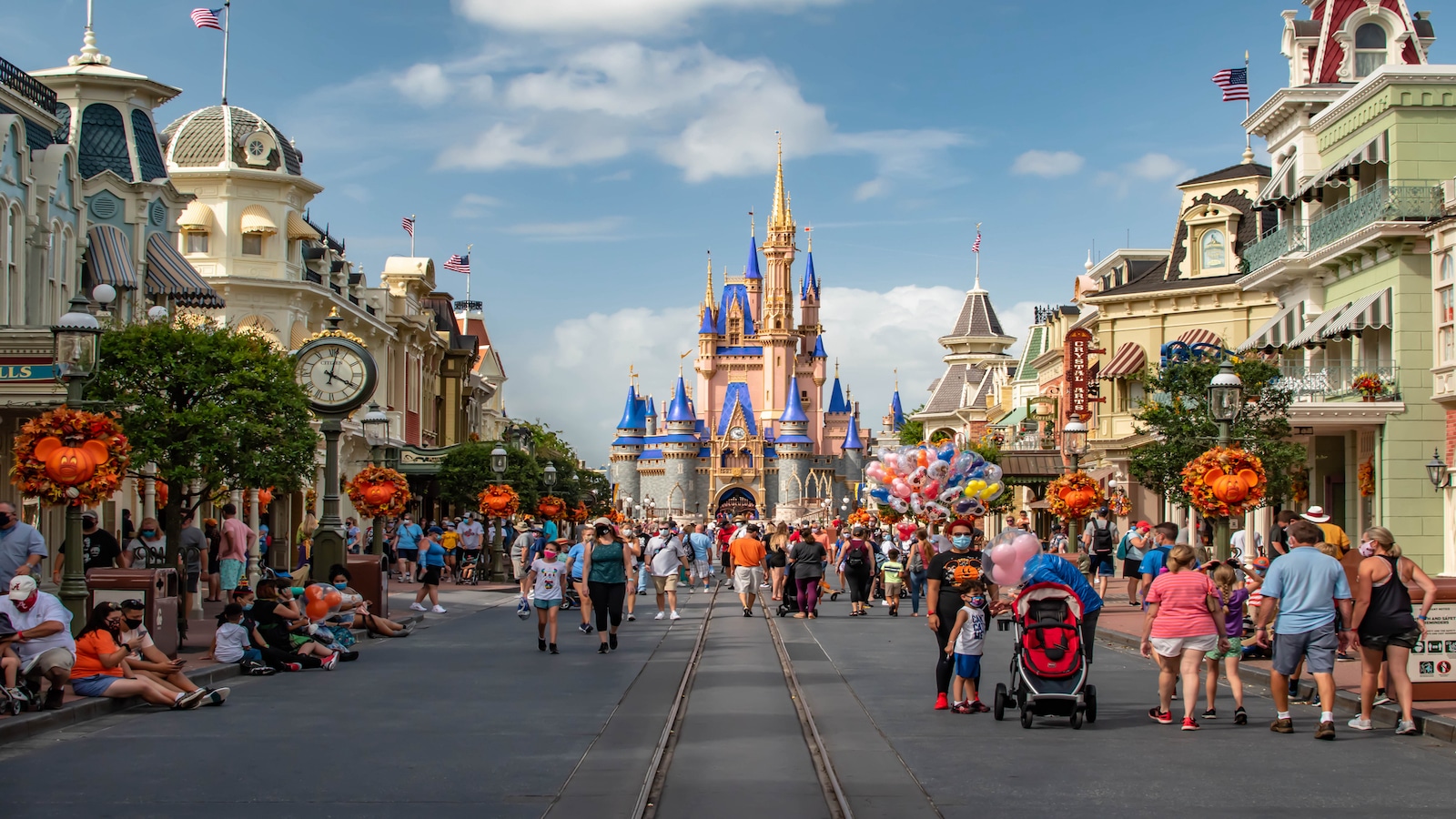 people walking at disney world.