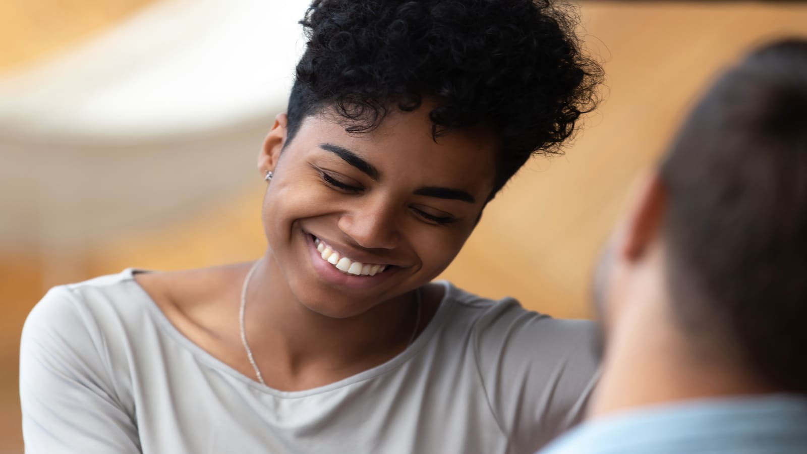 shy woman talking and smiling.