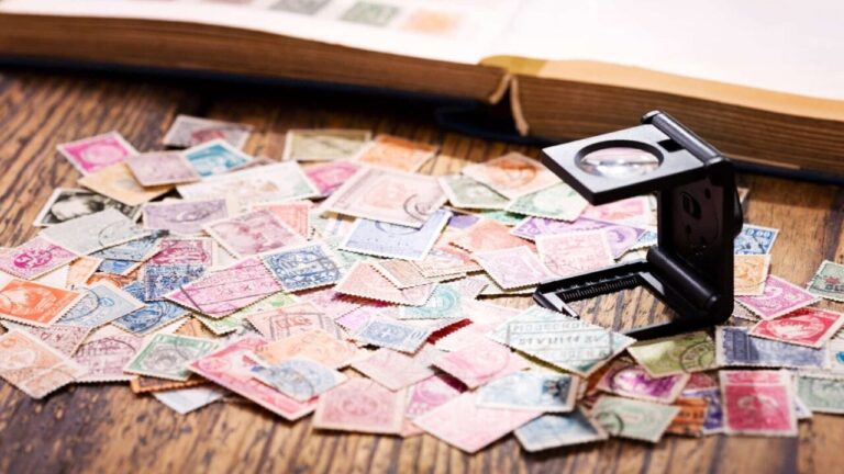Old postage stamps from various countries on wooden table. Stamps, old, vintage collectors, stamps and postage.