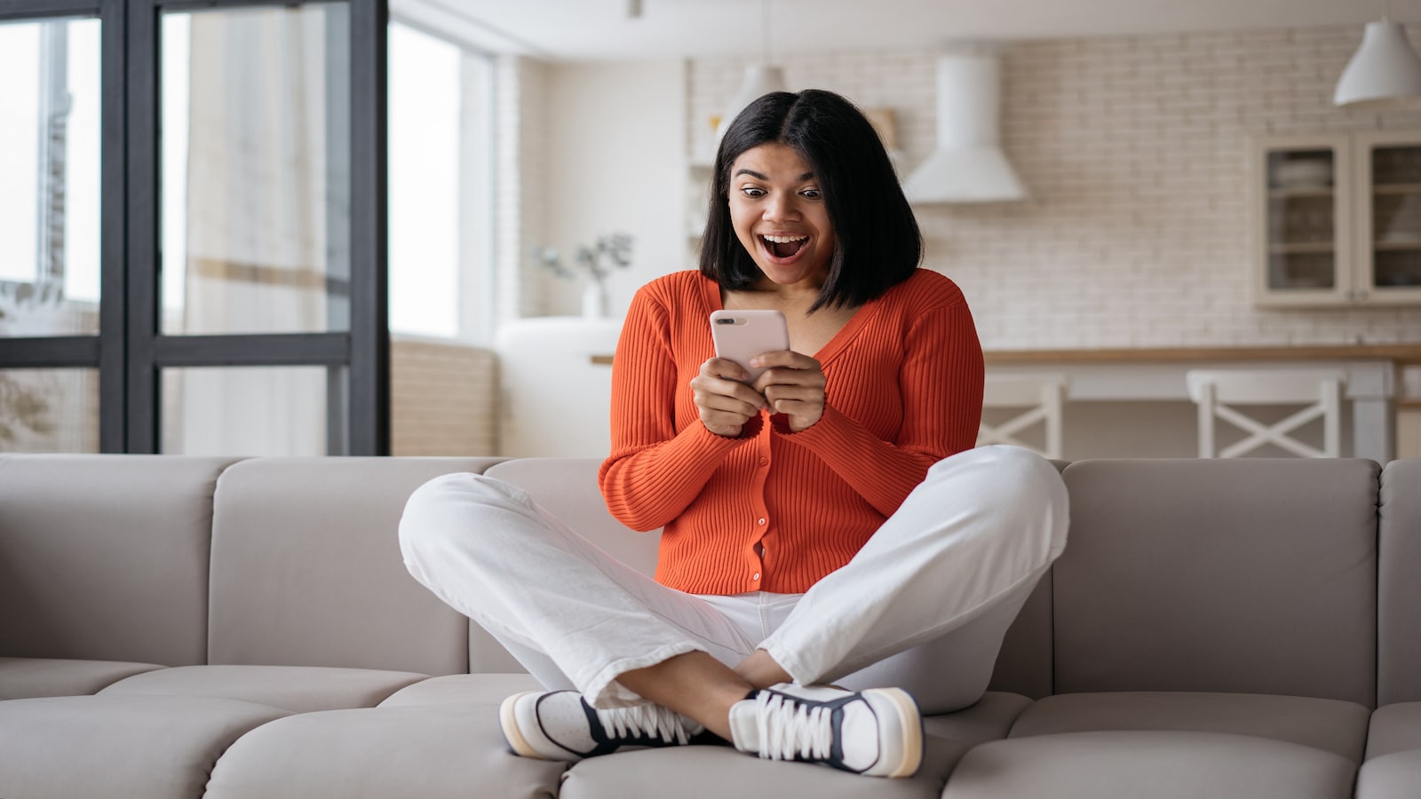 woman excited on phone.