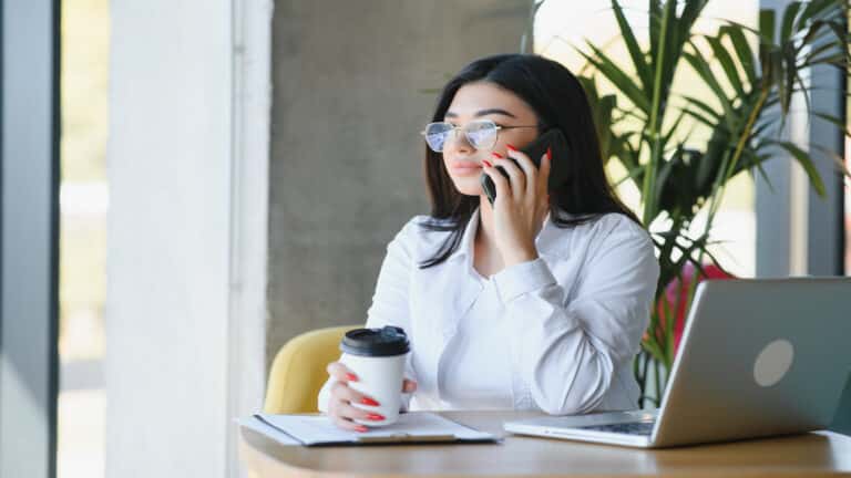 woman working and on phone.