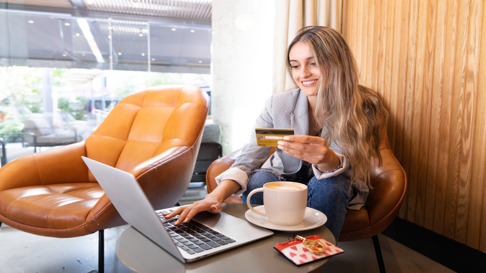 woman shopping online with credit card.