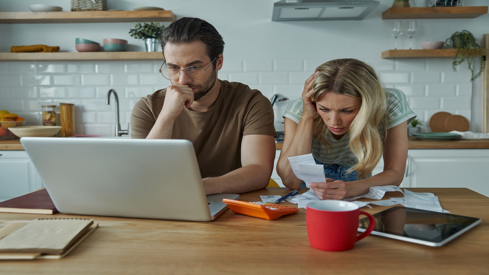 young couple stressed about money.