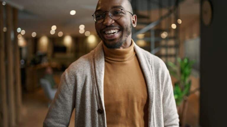 ​​Portrait of creative trendy man smiling laughing.