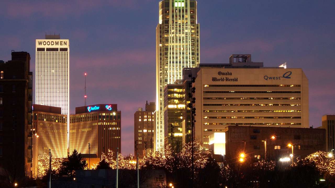 Downtown Omaha, Nebraska at night. First National building is in the center, with the Woodmen of the World tower on the left.