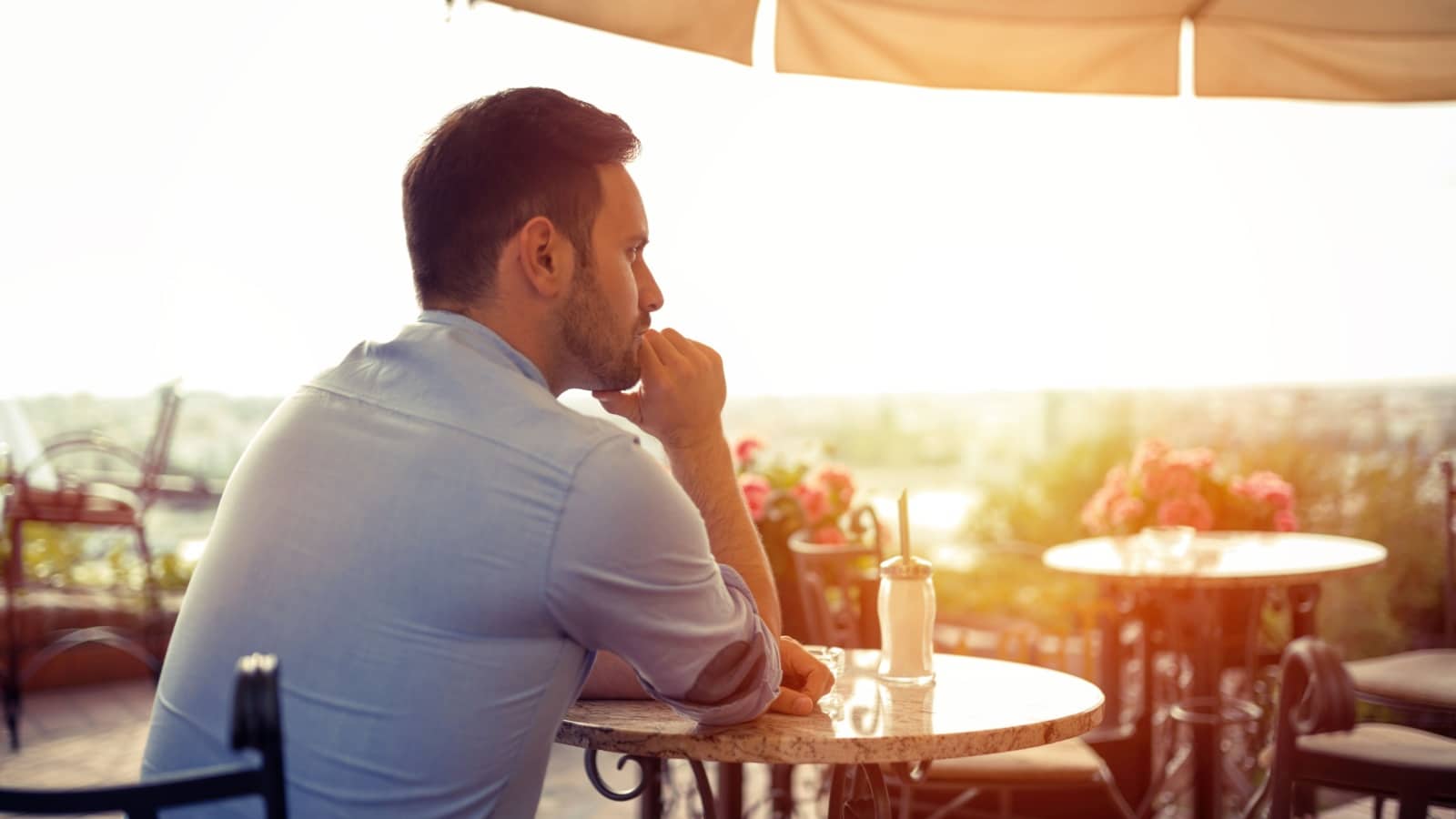 Sad alone man waiting for his date or friend