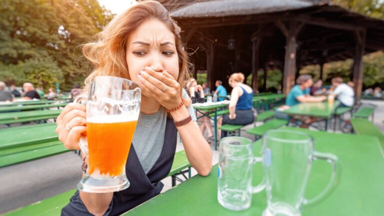 Woman drinking bad beer