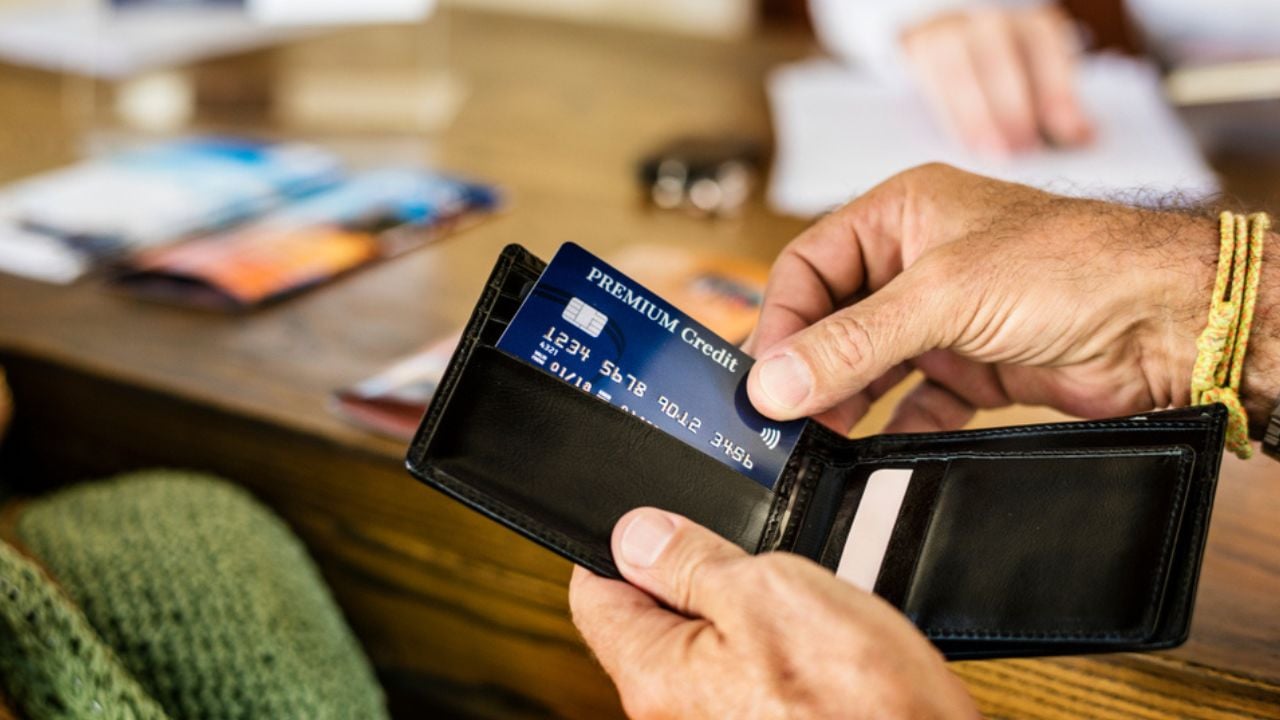 Guests checking in to a hotel using credit card