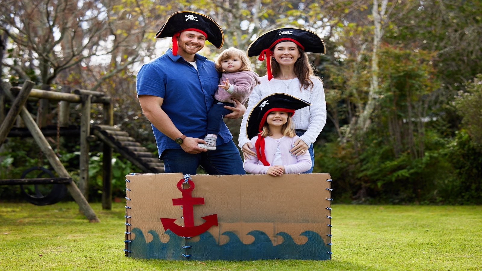 Family dressed up like pirates in the yard.