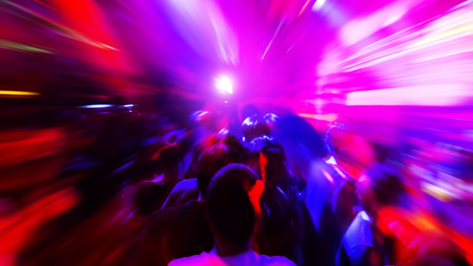 Dancing people in a disco club to the music