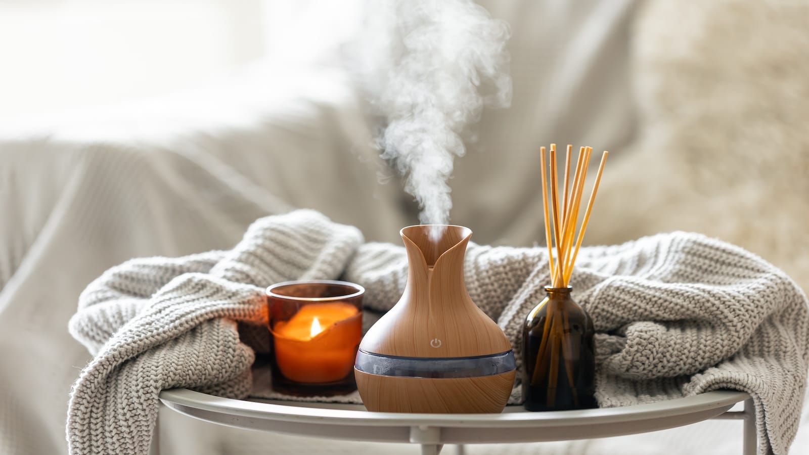 Aroma oil diffuser lamp with the stick perfume, knitted element and candle.