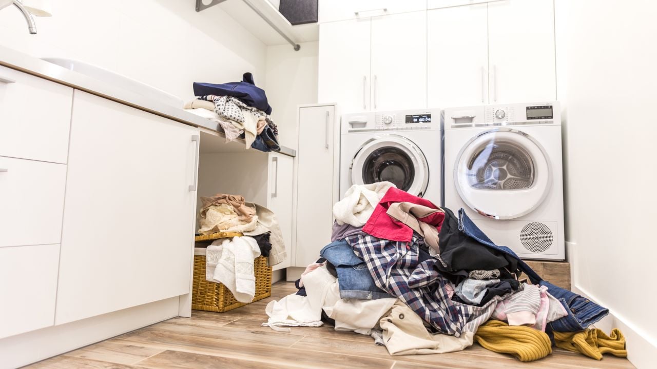 Forgotten clothes in laundry room washer dryer