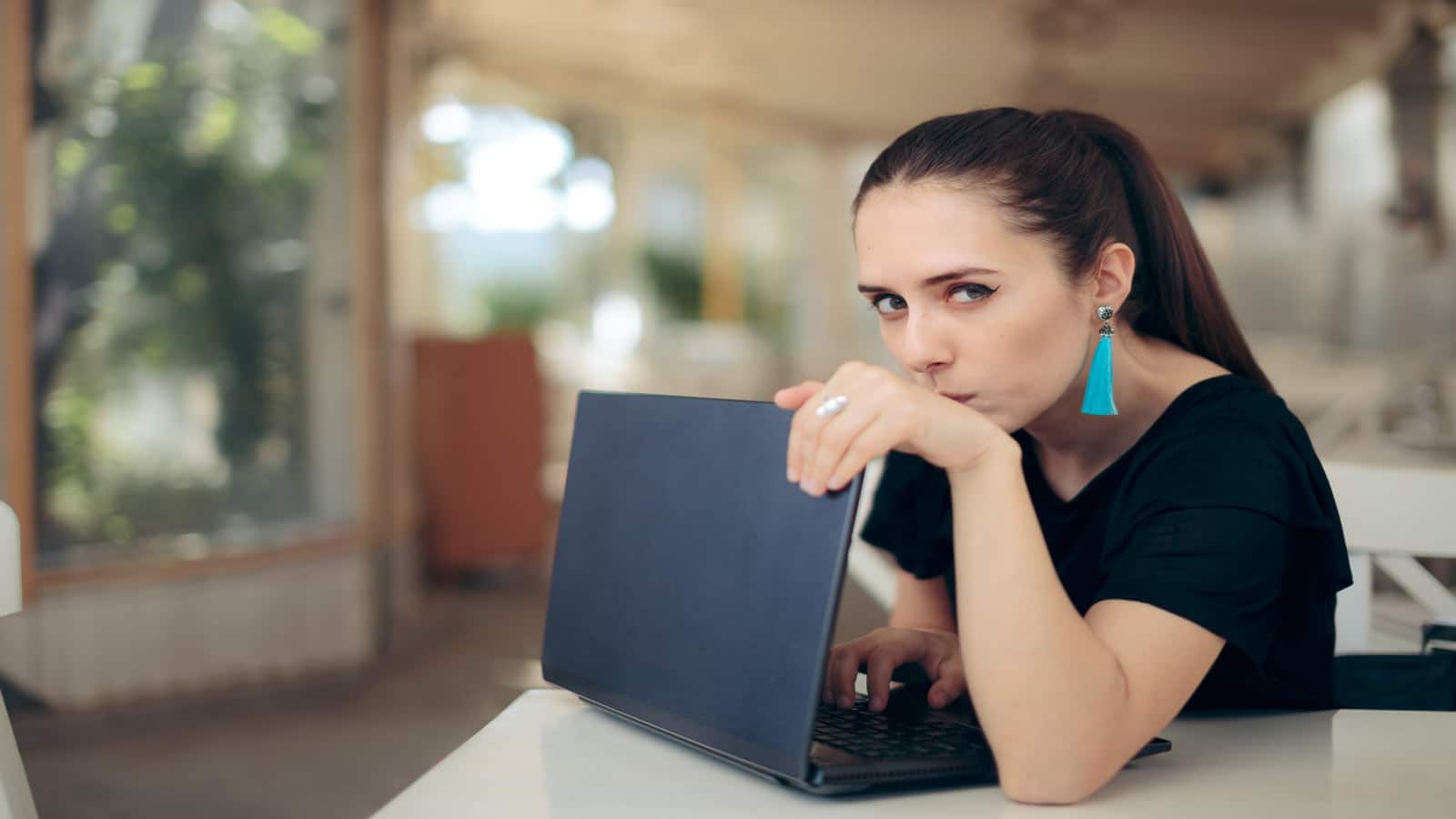 woman hiding laptop