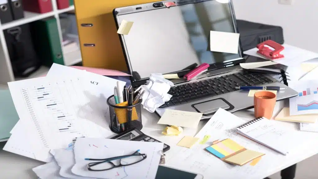 Messy and cluttered desk.