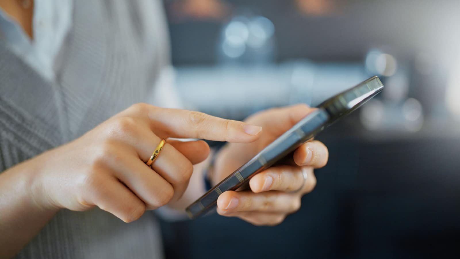 Smartphone, marketing and business hand contact information, website application or reading target advertising. Typing, scroll and social media network worker using phone or cellphone in bokeh zoom.