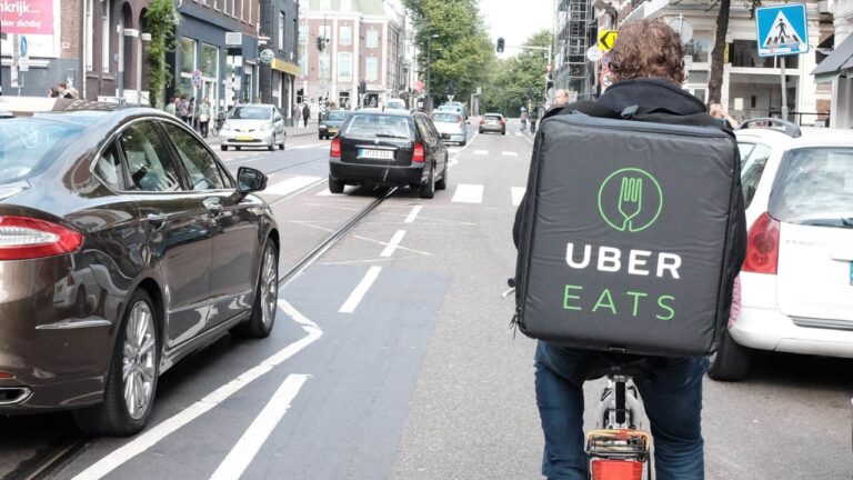 Cyclist with Uber Eats food storage.
