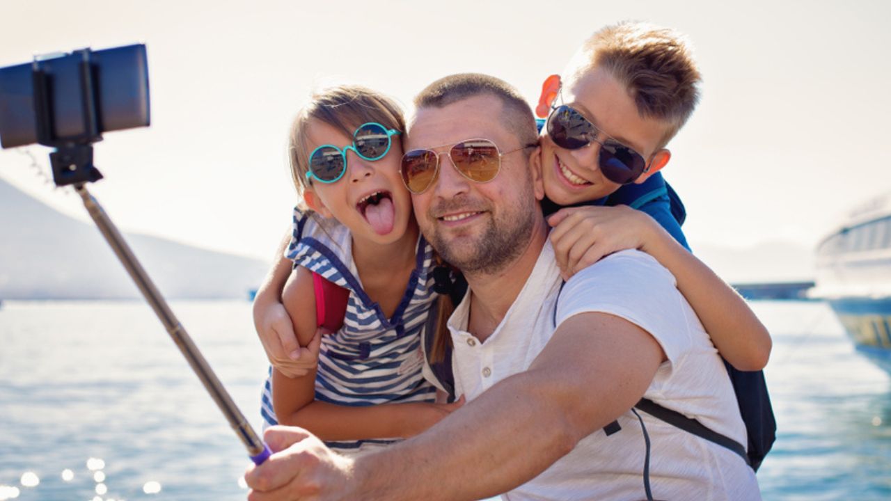 Father with children are waiting summer sea vacation.