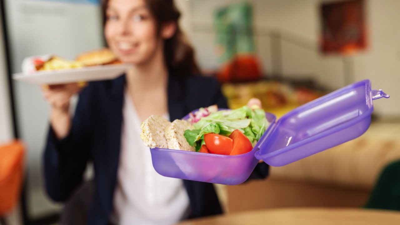 Woman holding a packed lunch