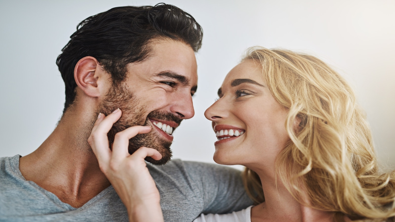 Loving happy couple looking at each other smiling.