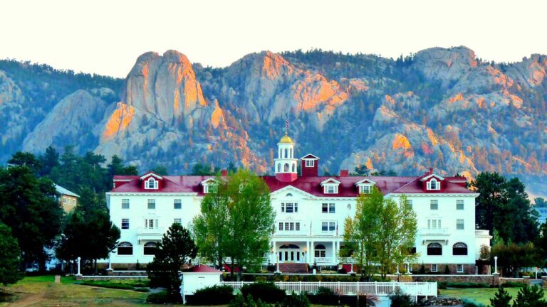 The historic Stanley Hotel in Estes Park, Colorado was established in 1909. Behind The Stanley (as it is known locally) is the "Twin Owls" rock formation.