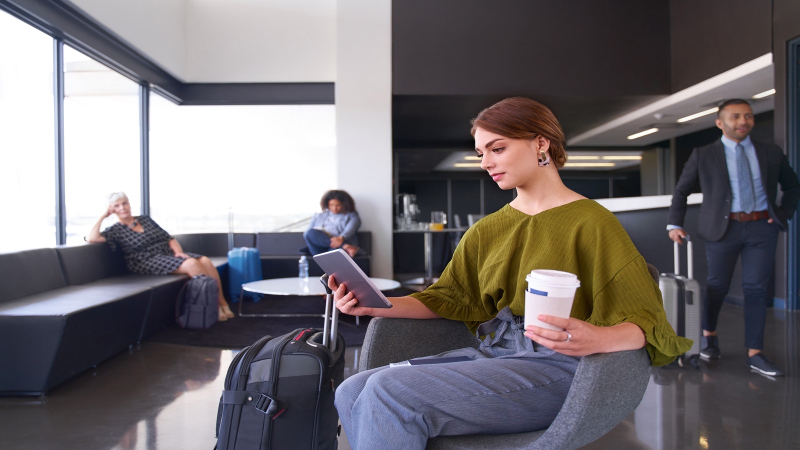 woman reading while waiting