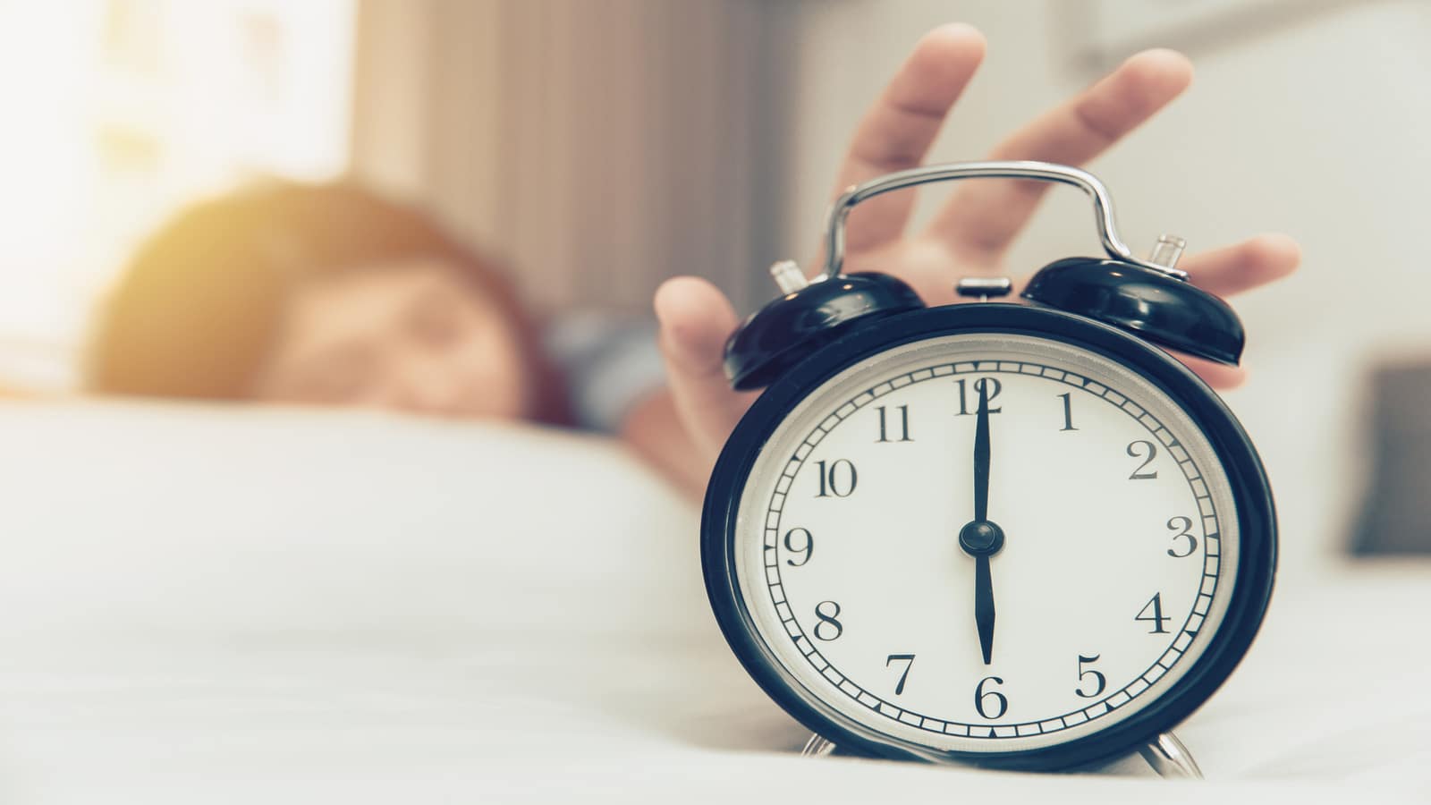 woman-turning-off-alarm