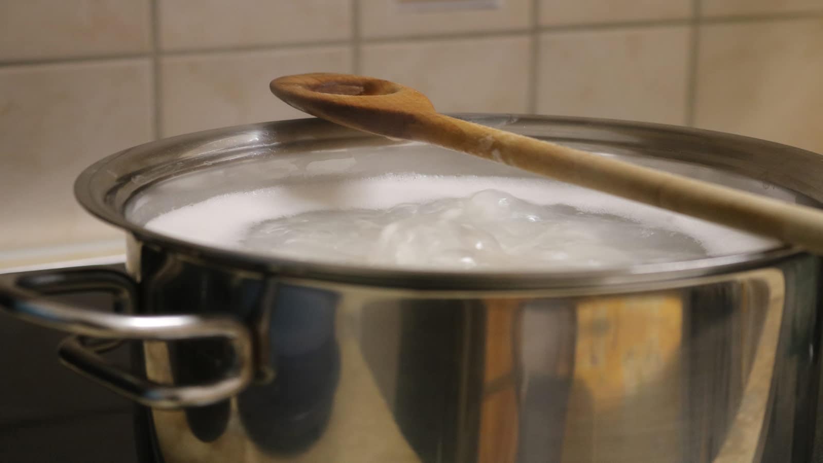 wooden spoon boiling pot