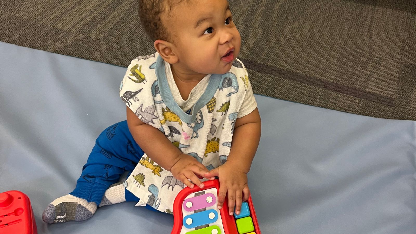 Zyden playing with toy.