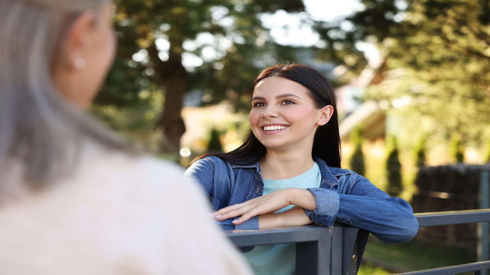 Woman smiling in yard.