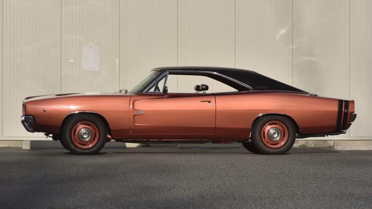 Side view of the burnt orange 1968 Dodge Charger 500 Hemi.