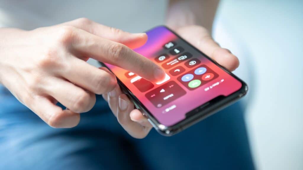 BANGKOK, THAILAND - DECEMBER 14, 2019: Hand holding apple Iphone 11 Pro Max with control center interface.
