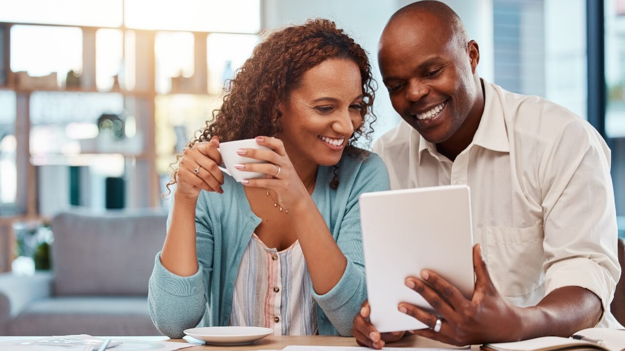 Man, woman on tablet, financial planning, paying bills, budget