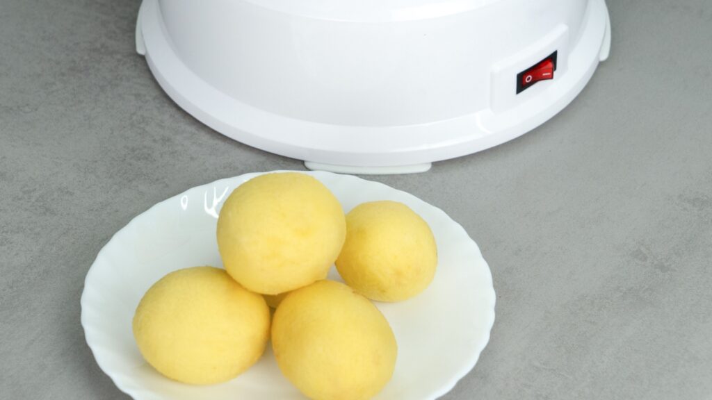 Electric potato peeler on the table.