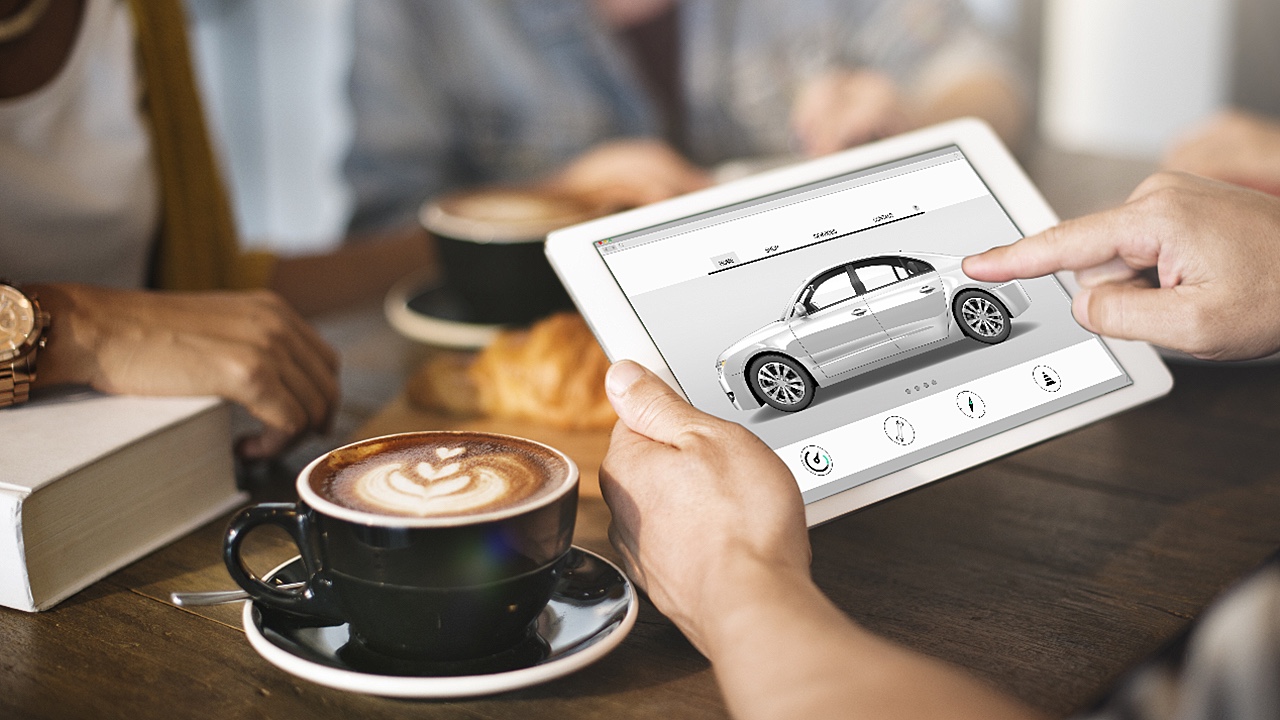 Person holding picture of a car