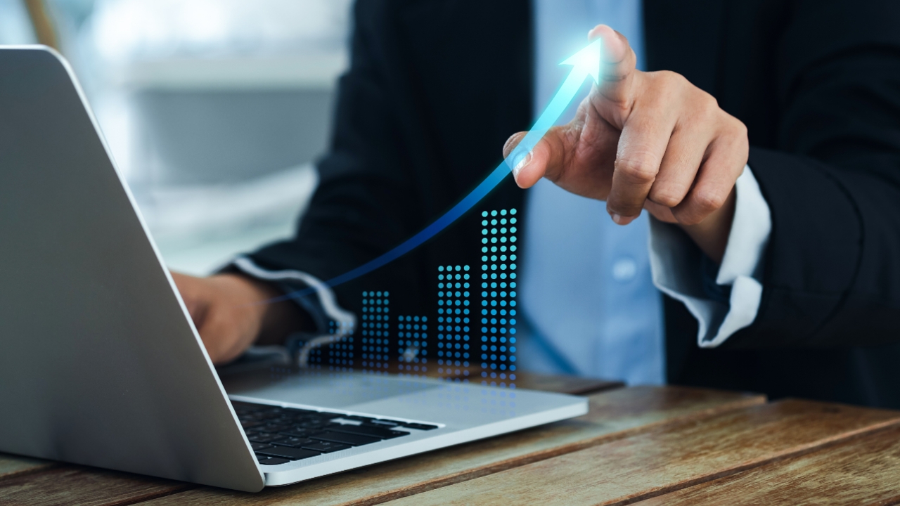 Laptop with graph showing increase in finances, invest, investments, goals, business, money, planning, retirement
