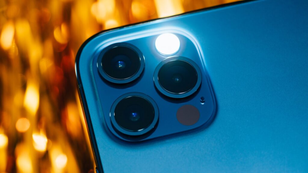 Paris, France - Oct 23, 2020_ Detail of the lidar sensor with flashlight on new iPhone 12 Pro Max 5G smartphone model by Apple Computers close-up of Pacific Blue mobile phone device featuring.