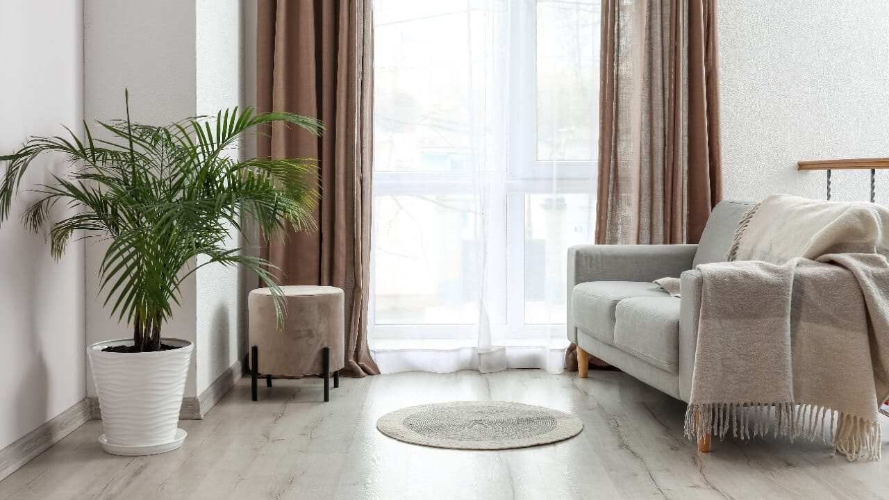 Sheer curtains in a neutral colored living room