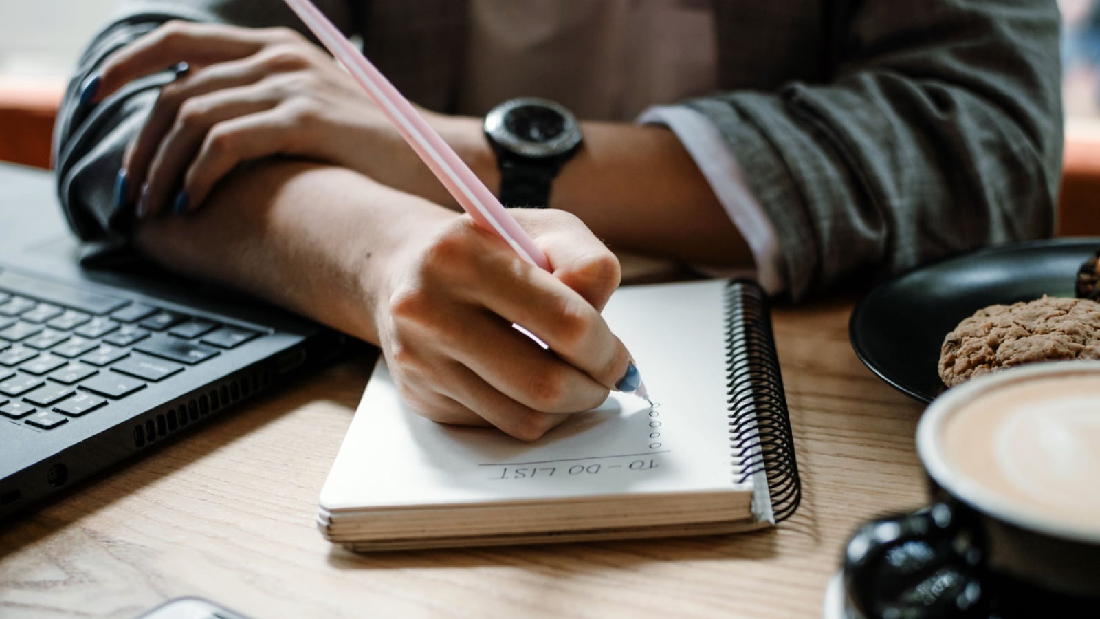 To do list, organize plans, projects, checklist, Productivity Works. Woman writing to do list. Close up of female hand writing check note in notebook. Selective focus
