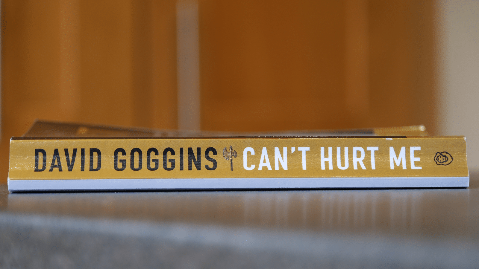 The book "Can't Hurt Me" sitting on a tabletop.