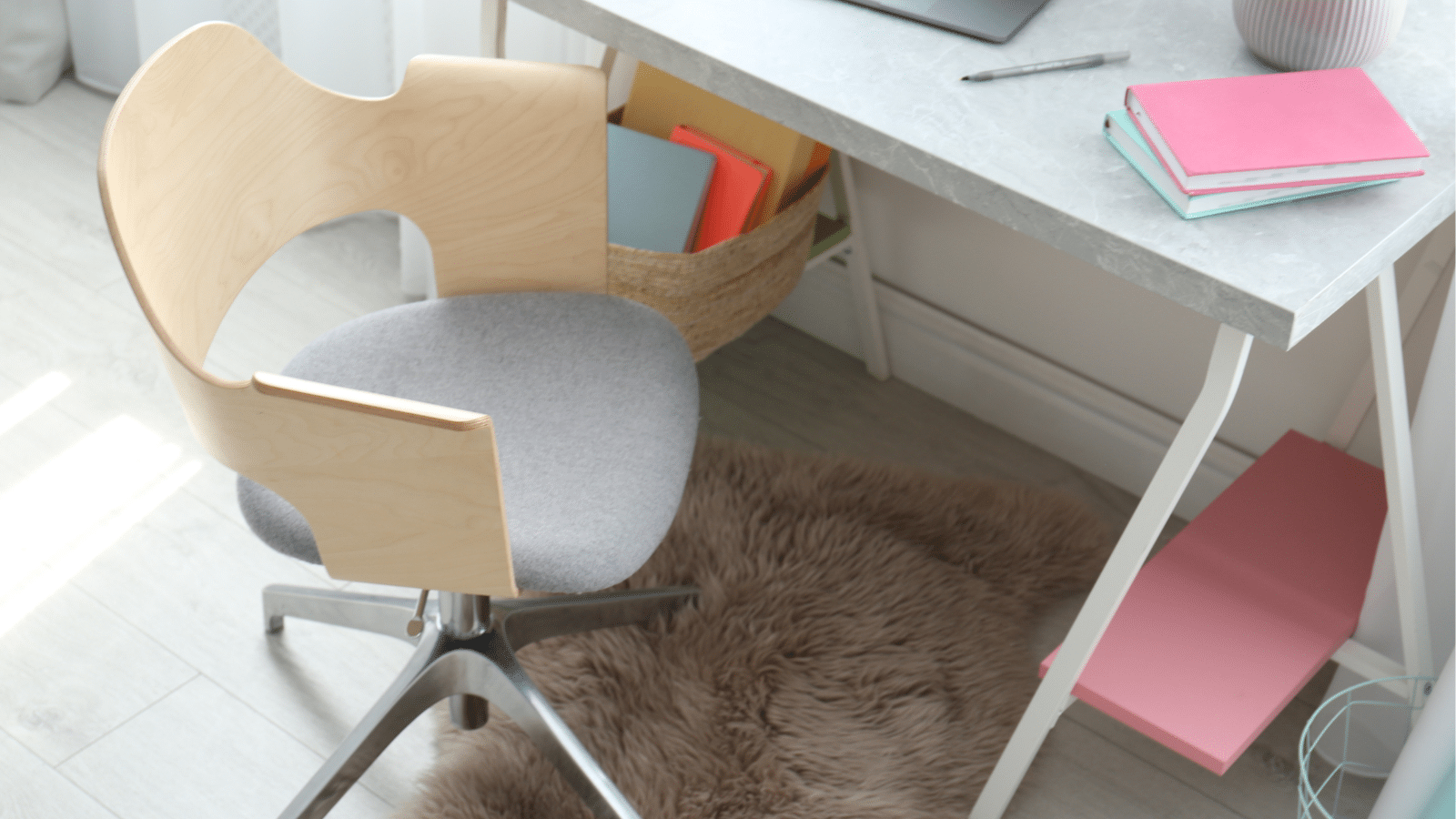 Comfortable cozy workplace with office chair and modern table.