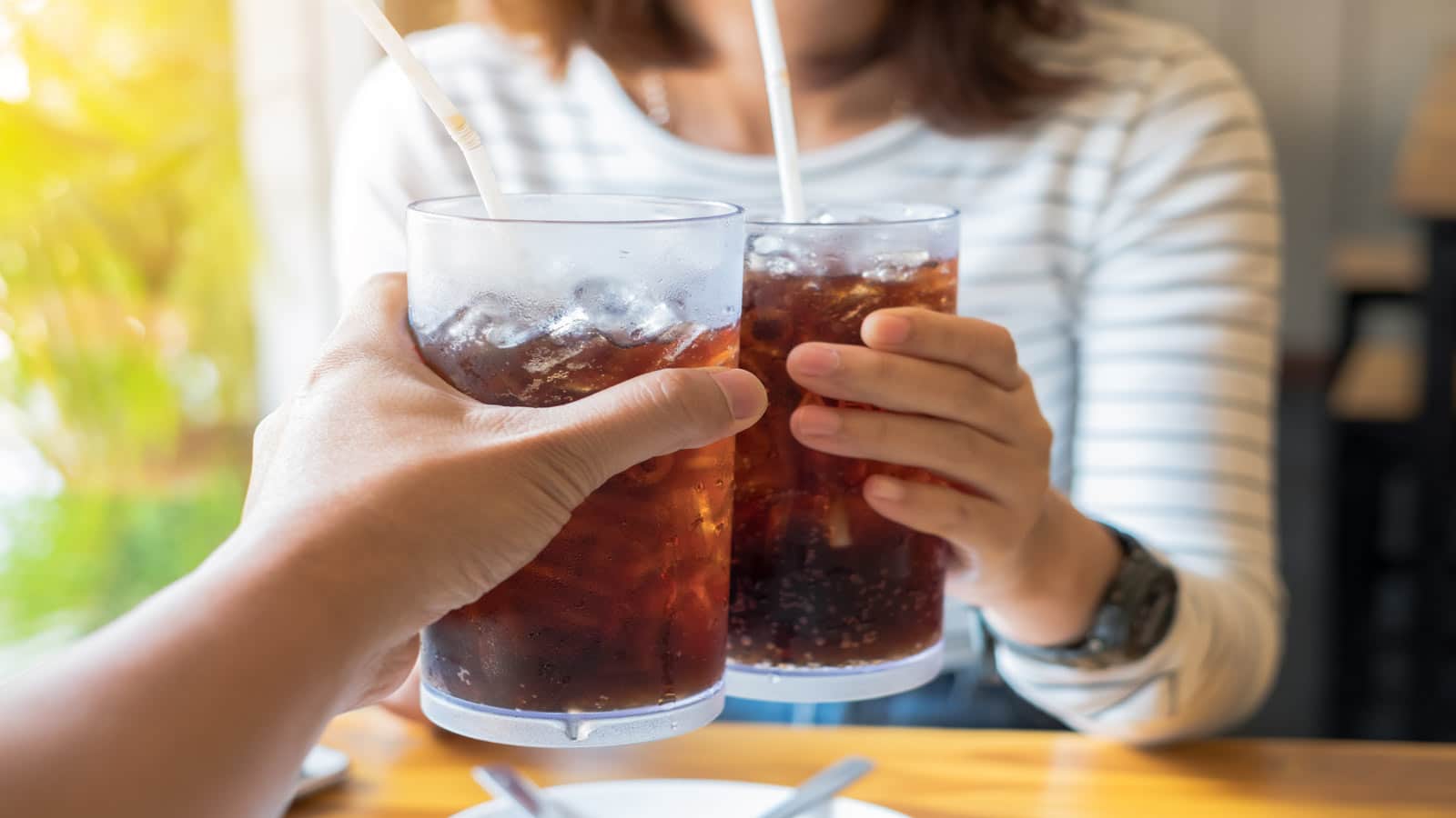 man woman drinking soda