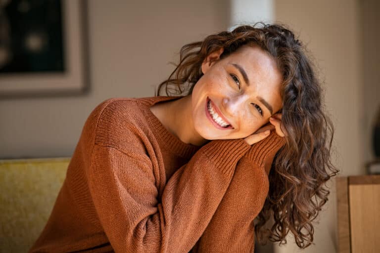 Happy young woman smiling.