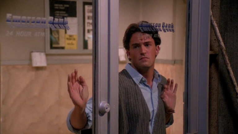 Matthew Perry as Chandler Bing, staring longingly out a glass door in "The One With the Blackout" (Friends, 1994-2004)