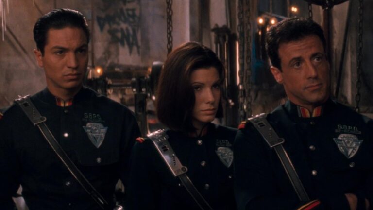 Sandra Bullock, Sylvester Stallone, and Benjamin Bratt in Demolition Man (1993).